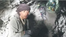  ?? ?? Afghan miners dig inside a tunnel of a gold mine in the mountains of Yaftal Sufla district in Badakhshan province.
