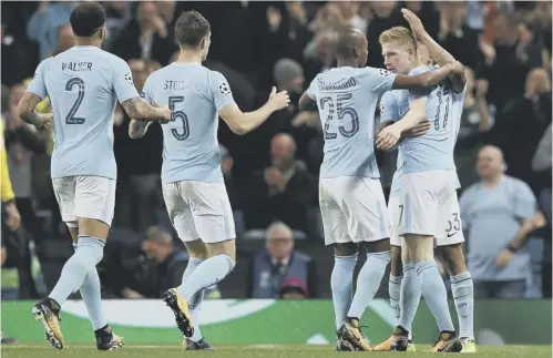  ??  ?? 0 The Manchester City players celebrate Belgian forward Kevin De Bruyne’s opening goal three minutes into the second half.