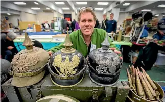  ?? PHOTO: MURRAY WILSON/FAIRFAX NZ ?? Shane Abercrombi­e with his World War I German helmets.