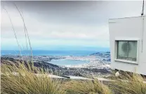  ?? PHOTOS: PAUL GORMAN ?? Looking down on central Dunedin from about 680m on top of Mt Cargill during Sunday’s southweste­rly gale.