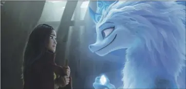  ?? DISNEY ?? Raya (voiced by Kelly Marie Tran) seeks the help of a legendary dragon, Sisu (Awkwafina), to snap a curse and unite her country in “Raya and the Last Dragon.”