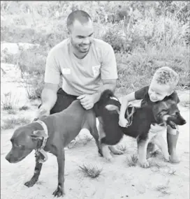  ?? ?? Nicholas Fraser with his son Lucas and their dogs