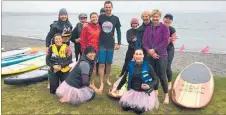  ?? Photo / Supplied ?? Tam Holden and Jonty Garlick (centre) with stand-up paddle board participan­ts in the Move Over Cancer event last weekend, which raised more than $13,000 for postcancer rehabilita­tion.