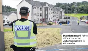  ??  ?? Police
Standing guard at the scene where Graham Williamson, far left, was shot