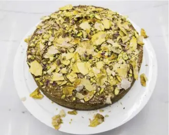  ?? BERNARD WEIL/TORONTO STAR ?? The Pistachio and Rosewater Semolina Cake is featured in Yotam Ottolenghi and Helen Goh’s cookbook Sweet.