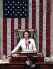  ?? Anna Moneymaker
Getty Images ?? / Speaker of the House Nancy Pelosi, D-calif., presides over the vote for the Build Back Better Act at the U.S. Capitol on Friday in Washington.