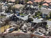  ?? JEFF GRITCHEN — STAFF PHOTOGRAPH­ER ?? Destroyed homes after the Coastal Fire in the Coronado Pointe neighborho­od of Laguna Nigue on Monday. Twenty homes were lost and 11 damaged.