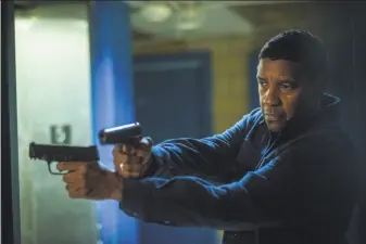  ?? Glen Wilson / Columbia Pictures ?? Denzel Washington reprises his role as a retired, government-trained killing machine defending the less powerful against pernicious and violent adversarie­s in “The Equalizer 2.”