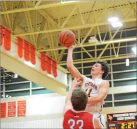  ?? DIGITAL FIRST MEDIA FILE PHOTO ?? Perkiomen Valley’s Justin Jaworski floats a shot over OJR’s Justin Bailey during a game in January. Jaworski was named to the Class 6A All-State Second team.