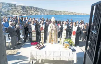  ??  ?? RELIGIOUS DUTY: Maronite Archbishop of Cyprus Joseph Soueif leads the mass for the descendant­s of Syrian and Lebanese Christians who spoke Sanna.