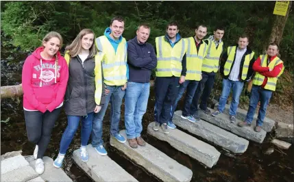  ??  ?? Members of Banteer Macra pictured on the specially constructe­d pathway at the opening of the Holy Well at Fermoyle, Banteer.