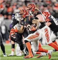  ?? Jeff Dean/Associated Press ?? Cincinnati Bengals running back Joe Mixon runs during a wild-card playoff game against the Baltimore Ravens last Sunday in Cincinnati.