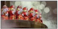  ?? (Bloomberg/Krisztian Bocsi) ?? Chocolate Santa Claus figures produced by Lindt & Spruengli on display inside a department store in Berlin in late 2017.