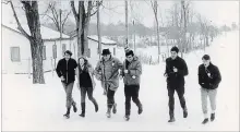  ?? TRENT UNIVERSITY ARCHIVE PHOTO ?? Stephen Stohn, left, Margaret Glossop, Tom Symons, Dalton Jacobs, and two unknown students walk The Great Walk on Jan. 27, 1968.