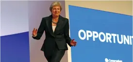  ?? (Darren Staples/Reuters) ?? BRITISH PM Theresa May dances to Abba’s ‘Dancing Queen’ before her keynote address at the Conservati­ve Party Conference in Birmingham yesterday.