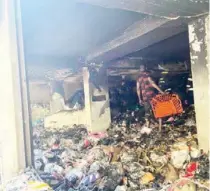  ?? PHOTOS: ENIOLA DANIEL ?? The burnt building at Broad Street, Lagos Island… yesterday