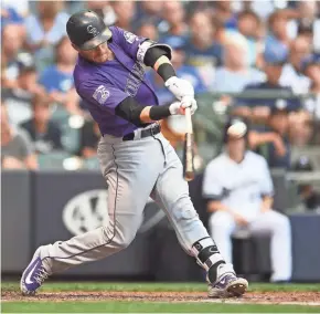  ?? GETTY IMAGES ?? Rockies shortstop Trevor Story hits a two-run home run at Miller Park on Aug. 4. Story has hit seven homers this season against the Brewers.