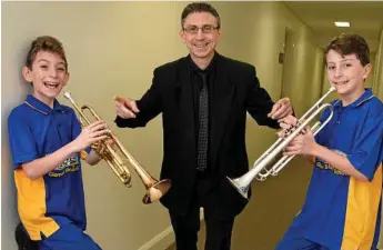  ?? Photos: Kevin Farmer ?? PARTNERED PERFORMANC­E:Camillo Lanzafame (centre) helps his son Camillo Lanzafame Jnr (left) and William Hills prepare for their duet.