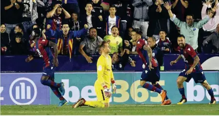  ??  ?? Barcelona’s Andres Ter Stegen slumped to his knees after conceding to Levante’s Emmanuel Boateng for the third time in Valencia on Sunday