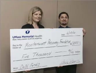  ??  ?? montachuse­tt recovery club held an open house last week at its new facility at 106 carter st., leominster. during a small ceremony at the open house, tricia pistone, the senior director of external affairs at Umass memorial Healthalli­ance-clinton Hospital, stands with matt Wright, the president of mrc, with a donation from Umass memorial Health of $5,000.