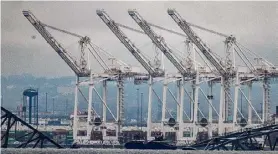  ?? Alex Brandon/associated Press ?? The cranes for the Port of Baltimore are idle on Wednesday.
