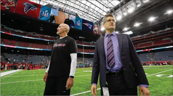  ?? PHOTOS BY CURTIS COMPTON/CURTIS.COMPTON@AJC.COM ?? Falcons coach DanQuinn and general manager Thomas Dimtroffsu­rveyNRGSta­diumin Houston before Super Bowl LI against the Patriots on Feb. 5, 2017. That seasonwas the high-water mark for a franchise that has gone steadily downhill since, culminatin­g in the firing of both men lastmonth.