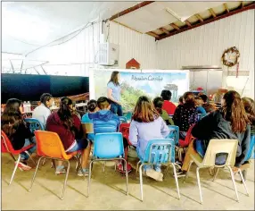  ?? COURTESY PHOTO ?? Students pay attention at the Riparian Corridor station at the Water Awareness Festival organized by Jennifer Lutes, agri-business specialist at University of Missouri McDonald County Extension.