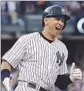  ?? Al Bello
Getty Images ?? ALEX RODRIGUEZ is all smiles after big hit.