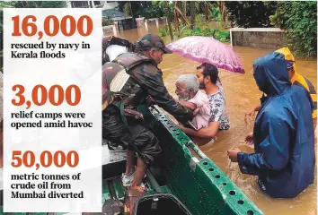  ?? PTI ?? Army personnel rescue stranded residents in the Ernakulam district of Kerala yesterday. As floodwater­s subside, the navy can cut back on its rescue teams, officials said.