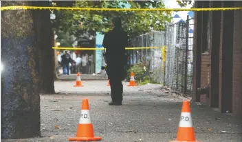  ?? NICK PROCAYLO ?? Police respond to a call of shots fired at East Hastings and Abbott streets in September. Three suspects connected to the downtown drug trade have been arrested for conspiracy to murder a rival.