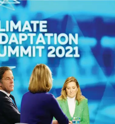  ?? (Photo/Xinhua) ?? On January 25, 2021, the first Climate Adaptation Summit, hosted by the Dutch government, opened in Hague.