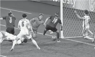  ?? REUTERS ?? Italy’s Leonardo Bonucci scores in the 67th minute to tie the Euro 2020 final match against England 1-1 at Wembley Stadium in London on Sunday. The Italians would go on to win the championsh­ip on penalty kicks.