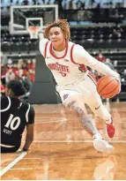  ?? ALIE SKOWRONSKI/COLUMBUS DISPATCH ?? Ohio State guard Kateri Poole drives past Cincinnati forward Jadyn Scott.