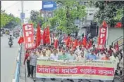  ??  ?? ■ CPI(M) supporters protest against the poll violence in Siliguri. The party’s central committee member Robin Deb alleged the state EC fixed the polling day without consulting political parties. AFP FILE