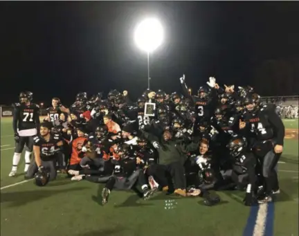  ?? MIKE STRIBL — DAILY FREEMAN ?? Marlboro High players and coaches pose for photos after Saturday night’s game at Dietz Stadium in Kingston, N.Y.