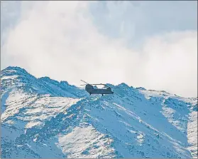  ??  ?? IAF‘S Chinook helicopter flies amid the prolonged India-china stand off in the Ladakh region.