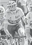  ?? LIONEL BONAVENTUR­E, AFP/GETTY IMAGES ?? Chris Froome has a 23-second lead in the Tour de France.