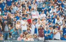  ?? David Zalubowski, The Associated Press ?? David Bote’s solo home run brings Chicago Cubs fans to their feet during the third inning.