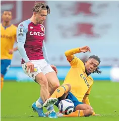  ??  ?? Aston Villa’s Jack Grealish is challenged by Alex Iwobi.