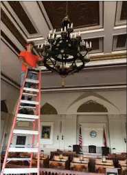  ?? CITY OF KINGSTON PHOTO PROVIDED ?? LED lighting installati­on is conducted in Council Chambers at Kingston City Hall last week.