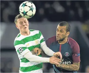  ??  ?? Head man: Celtic’s Callum McGregor gets to the ball before Dani Alves