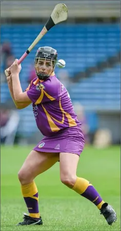  ??  ?? Ursula Jacob taking a free during her distinguis­hed playing career with the Wexford Senior camogie team.