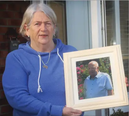  ??  ?? Margaret Brady with a photo of her late husband, Richard, at her home in Riverchape­l.