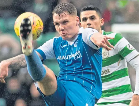  ?? SNS. ?? Jason Kerr, clearing from Celtic’s Tom Rogic, has enjoyed a breakthrou­gh season at St Johnstone.