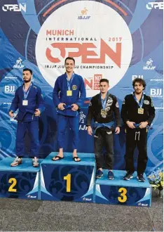  ?? Foto: Socher ?? Für Marius Socher ist Jiu Jitsu eine absolute Leidenscha­ft. Unser Bild zeigt ihn auf der Siegertrep­pe der IBJJF in München.