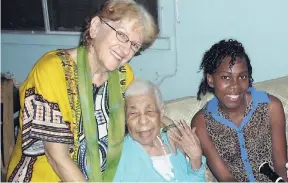  ?? FILE ?? Carmen Verity (centre) gets a hug from Rosina Christina Moder with Jenneta Brown sharing in the moment.