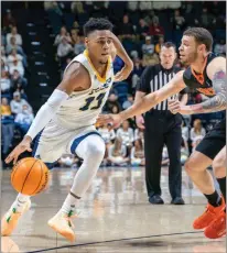  ?? GoMocs.com ?? Malachi Smith (left) added the Lou Henson National Player of the Year Award to his resume last week. Smith was also the Men’s Basketball Player of the Year in Southern Conference for the 20212022 season.