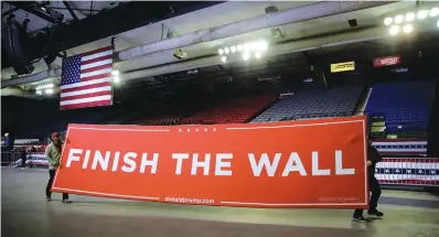  ?? Eric Gay/Associated Press ?? ■ Workers prepare for a President Donald Trump campaign rally Monday at El Paso County Coliseum in El Paso, Texas.