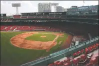  ?? The Associated Press ?? SCRIMMAGIN­G: Boston Red Sox play an intra-squad baseball game at a Fenway Park empty of fans on Thursday in Boston.