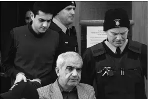  ?? Lars Hagberg, Reuters ?? Mohammad Shafia, bottom, and his son Hamed leave the Frontenac County courthouse in Kingston, Ont., after being found guilty of murder on Sunday.